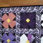 Ellie’s African Violet crib quilt