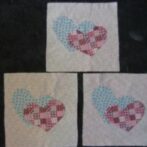 Appliqued snuggling hearts for Feb ’12